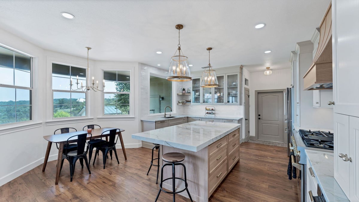 Large Bay Window and Kitchen Island with Seating at Cloud View Drive in San Antonio Remodel